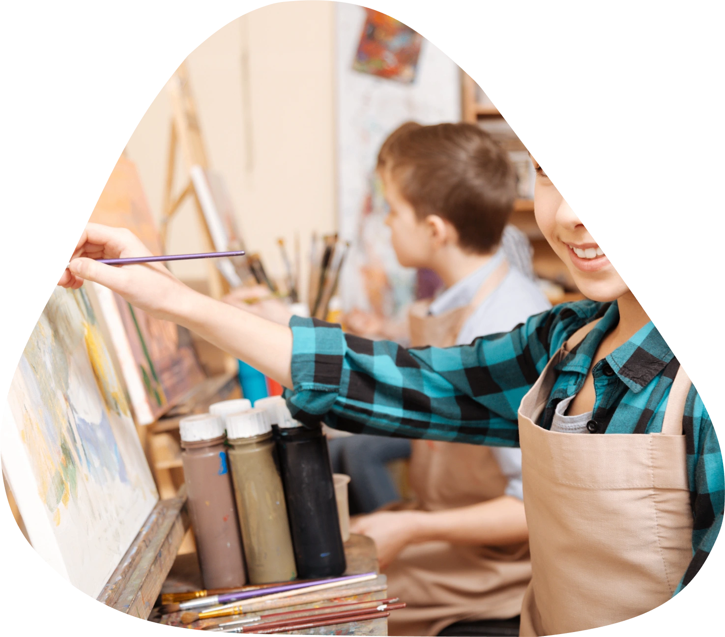 Children painting in an art class.