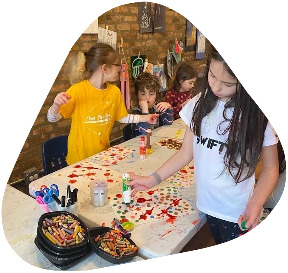 image-6 A group of children are making crafts at the table.