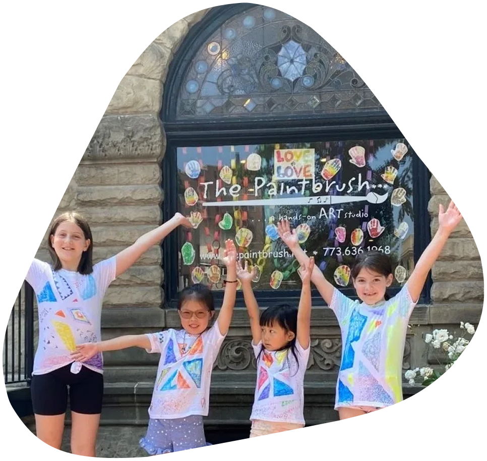 A group of children standing in front of a building.